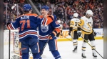 Edmonton Oilers' Ryan McLeod (71) and Corey Perry (90) celebrate a goal against the Pittsburg Penguins during second period NHL action in Edmonton on Sunday March 3, 2024. (THE CANADIAN PRESS/Jason Franson)