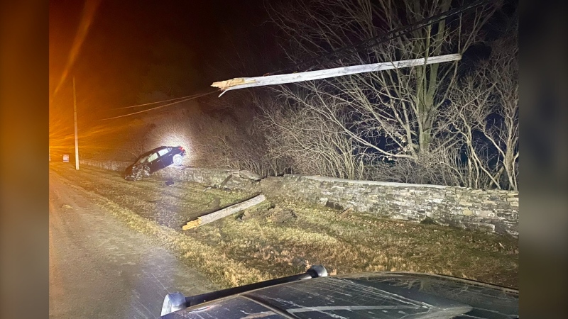 A vehicle slammed into a hydro pole on County Road 2 near Sharpe's Lane in Elizabethtown-Kitley Township Monday morning. Police say the driver of the vehicle is facing impaired driving charges. (OPP/X)
