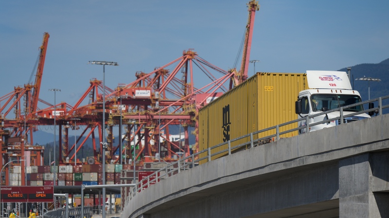 A new report finds that rising costs in trucking have overtaken the driver shortage as the biggest concern for employers in the sector. A transport truck carries a cargo container from the Centerm Container Terminal at port in Vancouver, on Friday, July 14, 2023. THE CANADIAN PRESS/Darryl Dyck