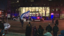 Pro-Israel and pro-Palestinian protesters outside the Federation CJA building in Montreal on Monday, March 4, 2024. (CTV News)