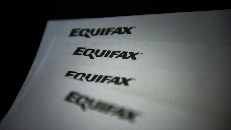 Equifax logos are shown on paper in Toronto on Oct.17, 2019. Equifax Canada says Ontario and British Columbia saw mortgage delinquency rates soar in the fourth quarter of 2023, surpassing pre-pandemic levels.THE CANADIAN PRESS/Christopher Katsarov
