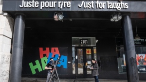 A news crew shoots a report in front of the Just for Laughs theatre is seen Tuesday, March 5, 2024 in Montreal. (Ryan Remiorz / The Canadian Press)
