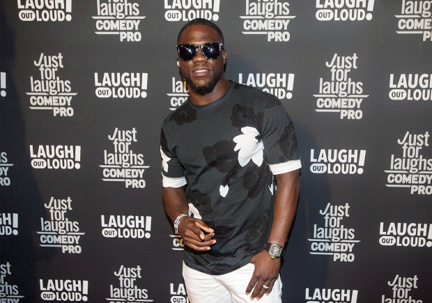 Comedian Kevin Hart poses as he arrives on the red carpet for Eat My Shorts: Short Films Premiere at the Just for Laughs comedy festival in Montreal, Thursday, July 27, 2017. (Graham Hughes/The Canadian Press)