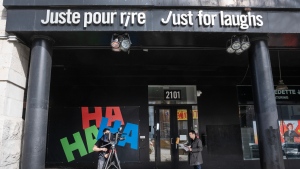 A news crew shoots a report in front of the Just for Laughs theatre is seen Tuesday, March 5, 2024 in Montreal. The company that runs the annual comedy festival has filed for bankruptcy protection. (Ryan Remiorz, The Canadian Press)