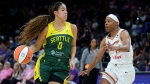 Seattle Storm guard Kia Nurse (0) dribbles the ball against Phoenix Mercury guard Shey Peddy during the first half of a WNBA basketball game Saturday, Aug. 5, 2023, in Phoenix. (AP Photo/Ross D. Franklin)