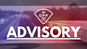 The Ontario Provincial Police crest in white with a police vehicle in the background and blue and red lighting indicating an advisory has been issued. (Supplied/Ontario Provincial Police)