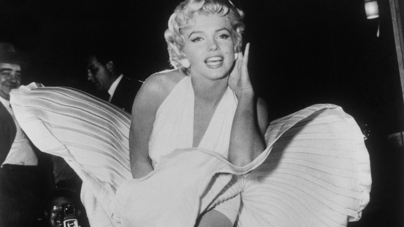 In this Sept. 9, 1954 file photo, Marilyn Monroe poses over the updraft of a New York subway grate while filming "The Seven Year Itch" New York. (AP Photo/Matty Zimmerman, File)