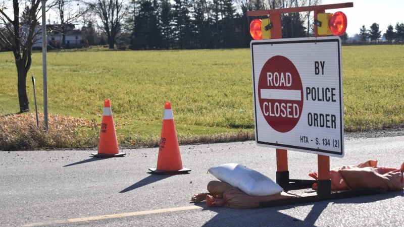 A sign and pylons indicating a roadway has been closed by police in Ontario. (File Photo/CTV News)