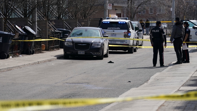 Police work the scene of a fatal shooting in downtown Toronto, Tuesday, March 12, 2024. THE CANADIAN PRESS/Arlyn McAdorey