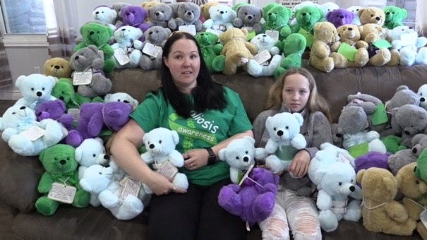 Tonya and Khloe Hummel of Seaforth, Ont. sit amongst more than 80 Higgy bears that they are donating to the orthopedic unit at London Health Sciences Centre for kids diagnosed with scoliosis. (Scott Miller/CTV News London) 