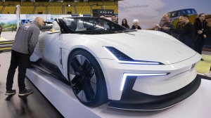 People look at the Polestar Roadster at the opening of the Electric Vehicle show, Friday, April 21, 2023 in Montreal. (Ryan Remiorz, The Canadian Press)