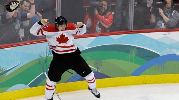 Canada's Sidney Crosby leaps in the air after making the game-winning goal in the overtime period of the men's gold medal ice hockey game against team USA at the 2010 Winter Olympic Games in Vancouver, Sunday, Feb. 28, 2010. (AP / Chris O'Meara, File)