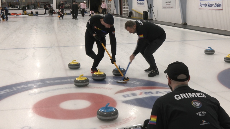 Jeremy Grimes watches a rock move towards the house while his teammates sweep the stone during the Canadian Pride Curling Championship in St. John's. (Garrett Barry)