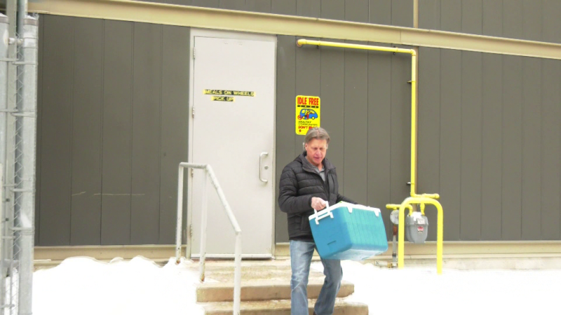 Dave Rubel has been volunteering with Meals on Wheels for more than a year and says he likes to help brighten people's day. He is seen loading a delivery earlier in March 2024. (joseph Bernacki/CTV News Winnipeg)