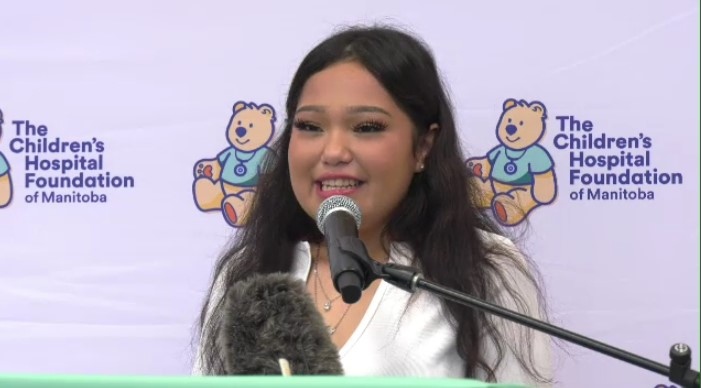 Janessa Dumas Colomb speaking at a news conference on March 14, 2023. 