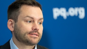 Parti Quebecois Leader Paul St-Pierre Plamondon speaks to the press in Montreal, Monday, Feb. 12, 2024. (Christinne Muschi, The Canadian Press)