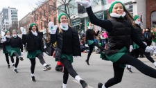 Irish dancers entertain the crowd during the St. Patrick's Day parade in Montreal, Sunday, March 19, 2023. (Graham Hughes/The Canadian Press)