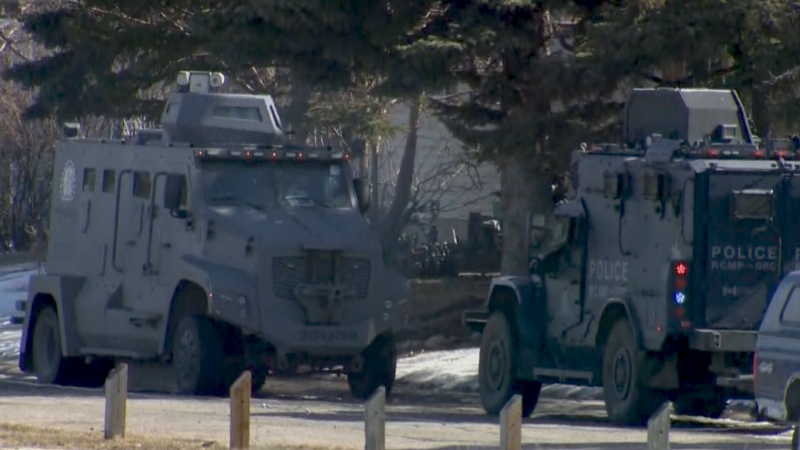 Police vehicles on the scene of a standoff at a home in the 300 block of Penswood Way S.E. (CTV News) 