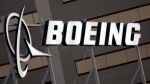 The Boeing logo is seen, Jan. 25, 2011, on the property in El Segundo, Calif. (AP Photo/Reed Saxon, File)