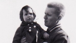 Jody Paterson, left, being held by her father when she was a toddler. Jody would learn through DNA testing that the man was not her biological father. (Photo provided by Jody Paterson)