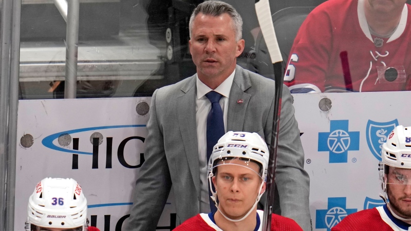 Montreal Canadiens head coach Martin St-Louis stands behind his bench during the first period of an NHL hockey game against the Pittsburgh Penguins in Pittsburgh, Thursday, Feb. 22, 2024. (Gene J. Puskar/The Associated Press)