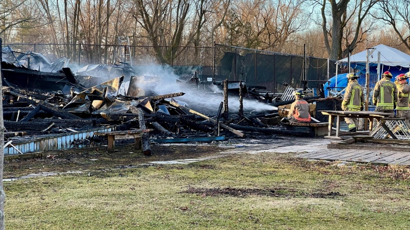 Crews extinguish a fire that broke out at the Ward's Island Association Clubhouse on March 17, 2024. (Simon Sheehan / CP24).
