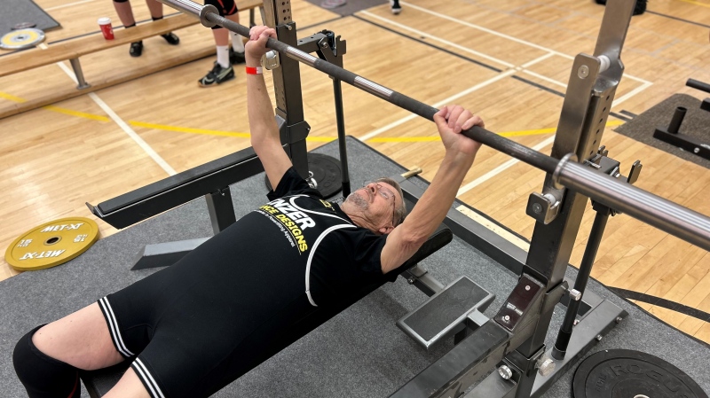 81-year-old Ron Brunner set a new provincial bench press record as part of a powerlifting event in Winnipeg on March 16, 2024. (Jon Hendricks/CTV News) 