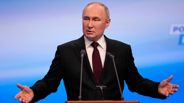 Russian President Vladimir Putin gestures while speaking on a visit to his campaign headquarters after a presidential election in Moscow, Russia, early Monday, March 18, 2024. (AP Photo/Alexander Zemlianichenko)