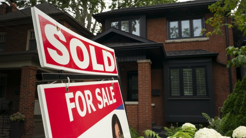 The Canadian Real Estate Association says February home sales jumped 19.7 per cent compared with a year ago. A West-end Toronto home for sale is shown in this July 15, 2023 file photo. THE CANADIAN PRESS/Graeme Roy