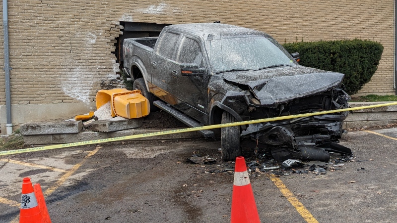 A Chevy Silverado slammed into a parked Ford F150, pushing it through the side of a townhouse on Berkshire Drive in London, Ont. on March 17, 2024. (Source: London police)