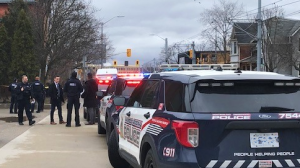Waterloo regional police at scene of a reported stabbing at Water Street North and Duke Street West in Kitchener on March 18, 2024. (Dave Pettitt/CTV Kitchener)