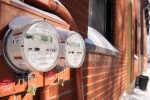 Electricity meters are shown on the side of homes in Montreal, Saturday, Feb. 4, 2023. Hydro-Quebec has asked customers to reduce their energy consumption as the region is going through a period of extremely cold weather. (Graham Hughes, The Canadian Press)