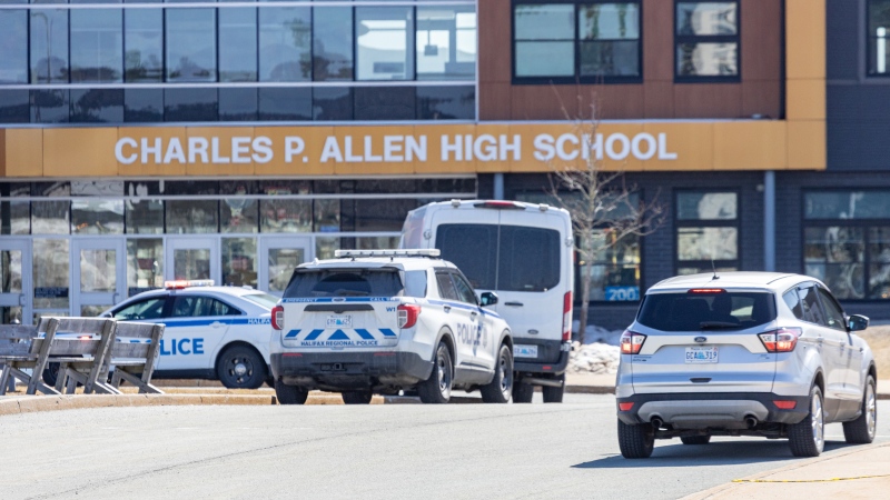 Police are pictured at Charles P. Allen High School in Bedford, N.S., on Monday, March 20, 2023. THE CANADIAN PRESS/Riley Smith