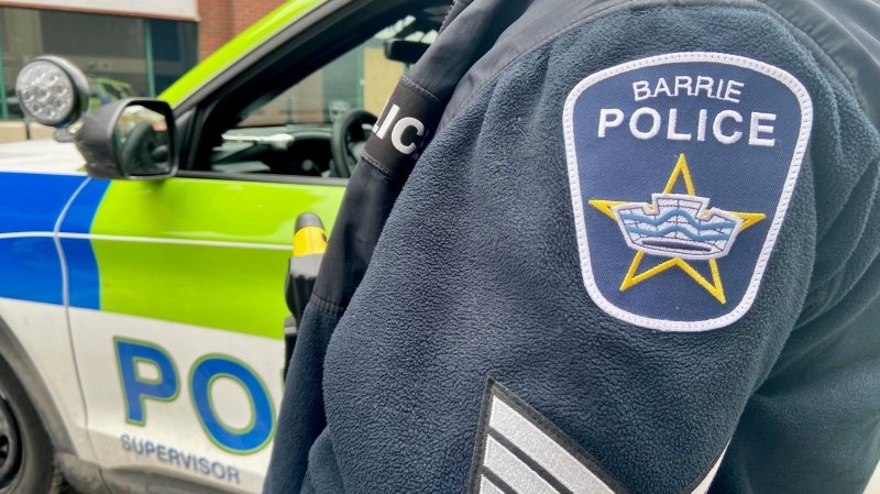 Barrie police badge and cruiser. (CTV News/Steve Mansbridge)
