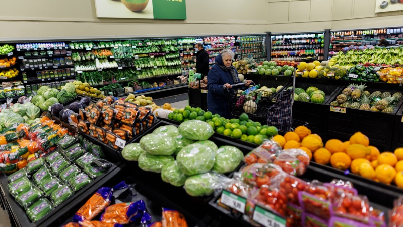 A customer walks through the produce section at a Metro grocery store In Toronto on Friday, Feb. 2, 2024. (Cole Burston / The Canadian Press)