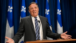 Quebec Premier Francois Legault gestures as he announces his decision to stop accepting private funding, Thursday, Feb. 1, 2024 at the legislature in Quebec City. (Jacques Boissinot, The Canadian Press)