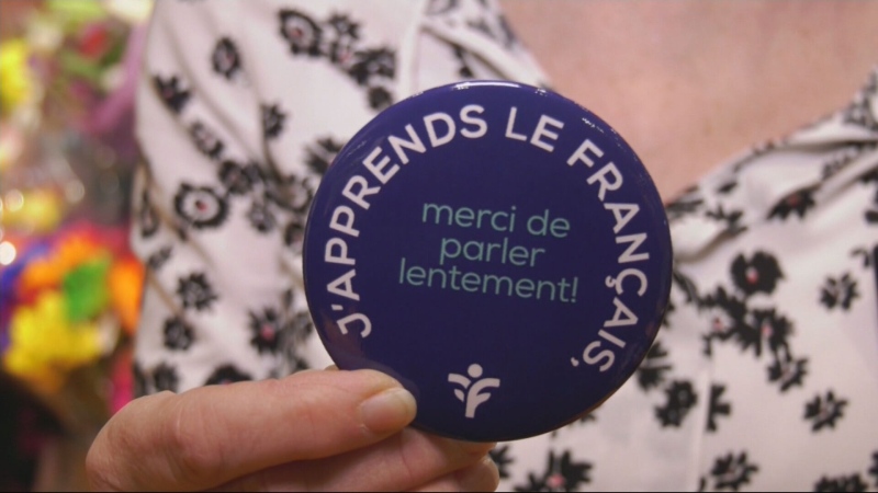 'I'm learning French, please speak slowly.' Employees at the Provigo in Boucherville wear buttons explaining to customers that they are learning French as they work to adapt to the province. 