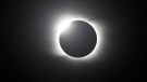 The moon covers the sun during a total solar eclipse in Piedra del Aguila, Argentina, Monday, Dec. 14, 2020. (AP Photo/Natacha Pisarenko)