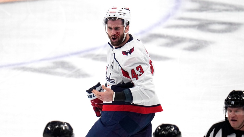 Washington Capitals' Tom Wilson heads to the locker room after getting a high stick to the face from Pittsburgh Penguins' Ryan Graves during the first period of an NHL hockey game in Pittsburgh, Thursday, March 7, 2024.  (AP Photo/Gene J. Puskar)