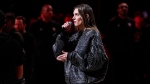 Charlotte Cardin performs the Canadian Nation Anthem before the start of the NBA All-Star basketball game in Indianapolis, Sunday, Feb. 18, 2024. (AP Photo/Darron Cummings)