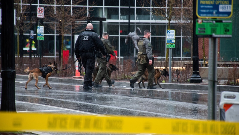 Police K-9's patrol around the blocked off 100 block of Queen Street in Lancaster City, Pa., on Saturday, March. 23, 2024. The Drag Story hour at the Lancaster Public Library was canceled after police responded to a suspicious package. (Amber Ritson/LNP/LancasterOnline via AP)