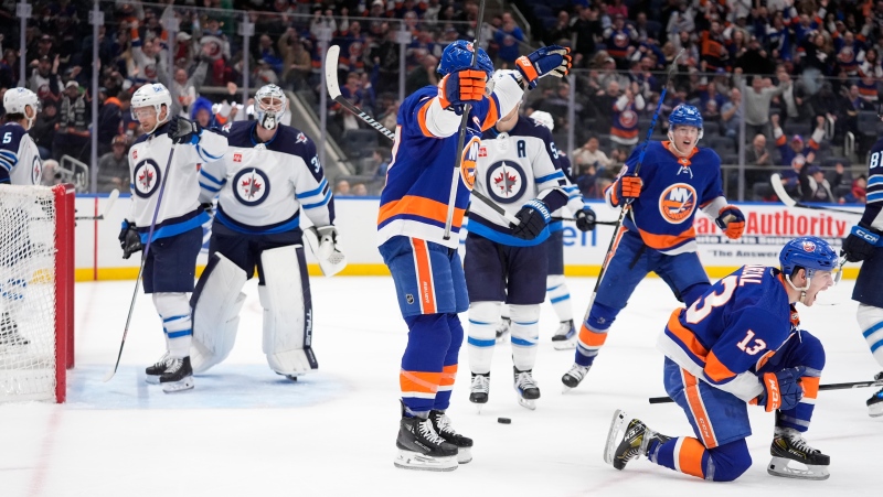 New York Islanders' Mathew Barzal (13) celebrates after scoring a goal during the second period of an NHL hockey game against the Winnipeg Jets Saturday, March 23, 2024, in Elmont, N.Y. (Frank Franklin II/AP Photo)