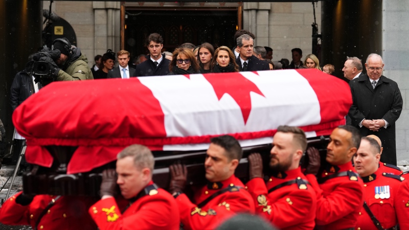 Immediate family members look on as RCMP pallbearers carry the casket to the hearse following the funeral of former prime minister Brian Mulroney, in Montreal, Saturday, March 23, 2024. (Sean Kilpatrick, The Canadian Press)