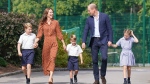 From left, Britain's Prince George, Kate Duchess of Cambridge, Prince Louis, Prince William and Princess Charlotte, arrive for a settling in afternoon at Lambrook School, near Ascot, England, Wednesday, Sept. 7, 2022. (Jonathan Brady/Pool Photo via AP, File)