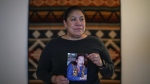 Naneek Graham holds a photograph of her father John Graham, who is incarcerated in the South Dakota State Penitentiary in Sioux Falls, while posing for a photograph at her home in Vancouver, on Tuesday, February 27, 2024. John Graham was extradited to the U.S. in 2007 and convicted three years later in the 1975 murder of Anna Mae Pictou Aquash, a member of the American Indian Movement who was found dead in South Dakota. THE CANADIAN PRESS/Darryl Dyck