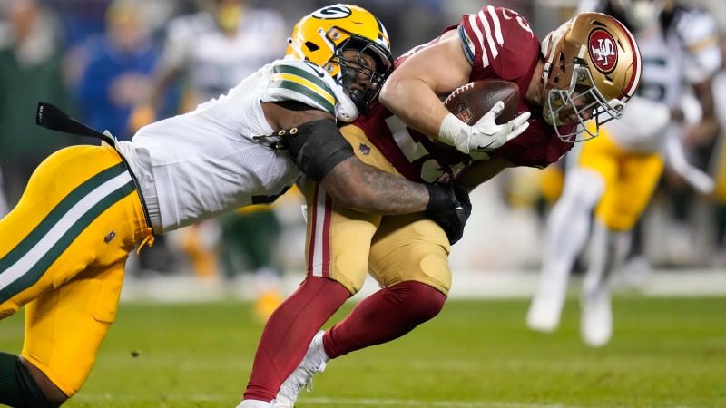 San Francisco 49ers running back Christian McCaffrey (23) is tackled by Green Bay Packers linebacker Quay Walker (7) during an NFL football game Sunday, Jan. 21, 2024, in Inglewood, Calif. (AP Photo / Ashley Landis)