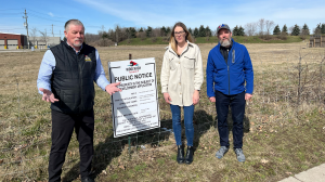 Breslau residents Stephen Lindsay, Eryn Koncir and Martin England stand in front of the lot where the proposed residential complex would stand. (Stefanie Davis/CTV Kitchener)
