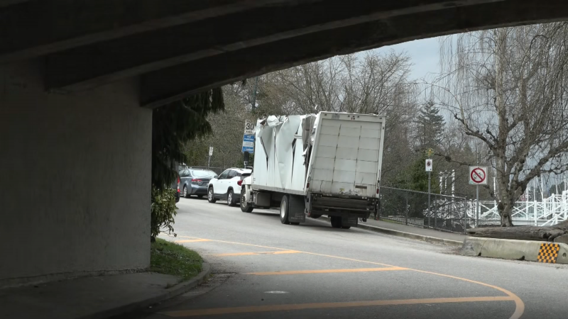 A damaged truck is seen after driving under a pedestrian overpass in Stanley Park on March 25, 2024.