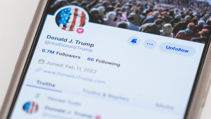The Truth Social account for former U.S. president Donald Trump is seen on a mobile device, Wednesday, March 20, 2024, in New York. (AP Photo/John Minchillo, File)