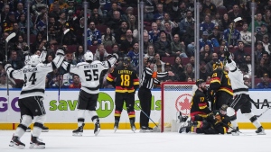 Los Angeles Kings celebrate a goal by Anze Kopitar, back left, against Vancouver Canucks goalie Casey DeSmith (29) in Vancouver, B.C., Monday, March 25, 2024. THE CANADIAN PRESS/Darryl Dyck